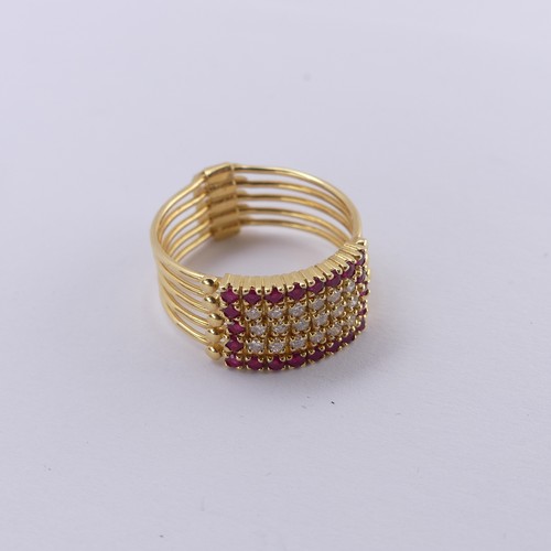 266 - An 18ct yellow gold multi-strand Ring, the five strands variously set with rubies and diamonds, hing... 