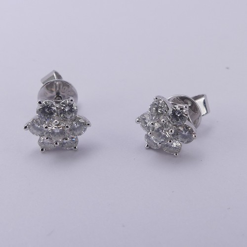 233 - A pair of diamond cluster Earrings, the central brilliant cut stone approx. 0.12ct claw set above si... 