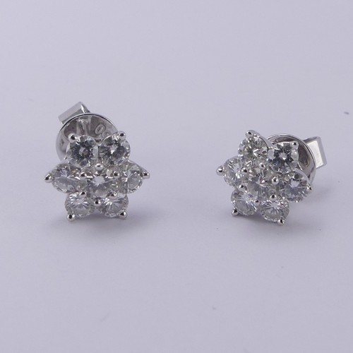 233 - A pair of diamond cluster Earrings, the central brilliant cut stone approx. 0.12ct claw set above si... 