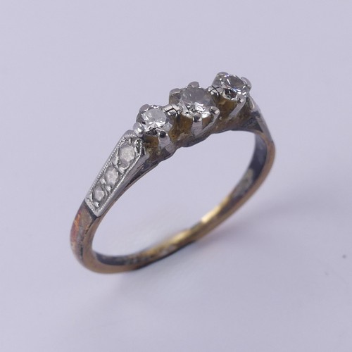 169 - A small three stone diamond Ring, mounted in 18ct yellow gold and platinum, Size O, 2.5g.... 