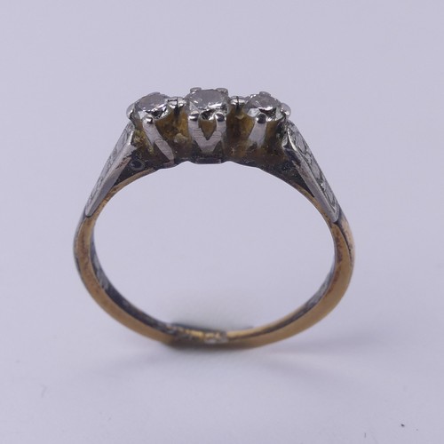 169 - A small three stone diamond Ring, mounted in 18ct yellow gold and platinum, Size O, 2.5g.... 