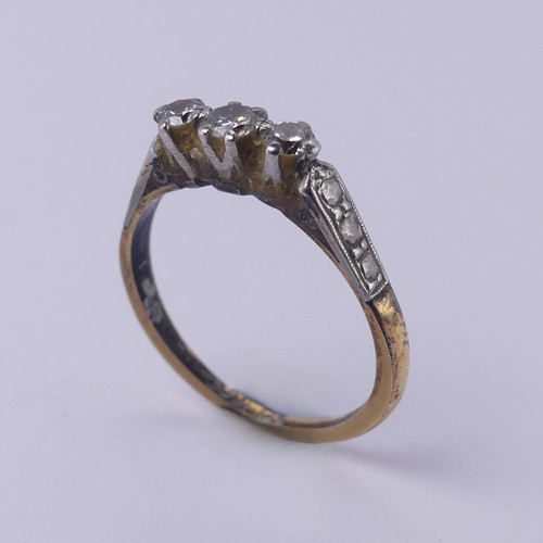 169 - A small three stone diamond Ring, mounted in 18ct yellow gold and platinum, Size O, 2.5g.... 