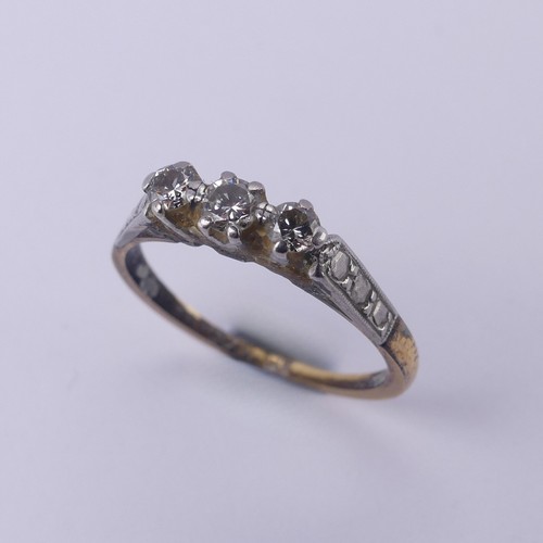 169 - A small three stone diamond Ring, mounted in 18ct yellow gold and platinum, Size O, 2.5g.... 