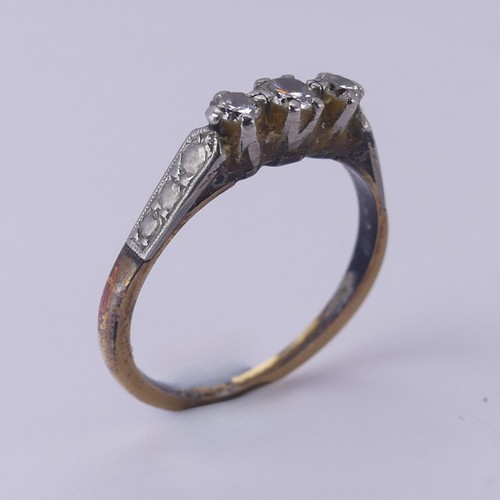 169 - A small three stone diamond Ring, mounted in 18ct yellow gold and platinum, Size O, 2.5g.... 