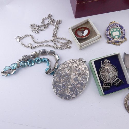 270 - A silver hinged Bangle, with gilt foliate decoration, together with a quantity of silver prize fobs ... 