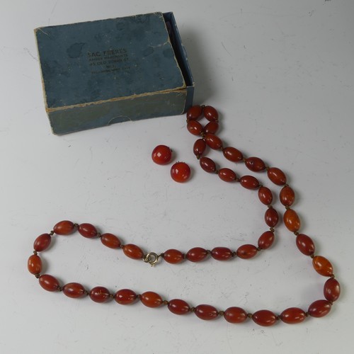 271 - A string of oval Amber Beads, slightly graduating, c.15mm - 15mm, individually knotted on string wit... 