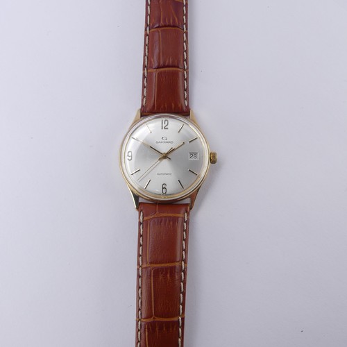 98 - A Garrard 9ct gold automatic Wristwatch, the silvered dial with Arabic quarter numerals and baton ma... 