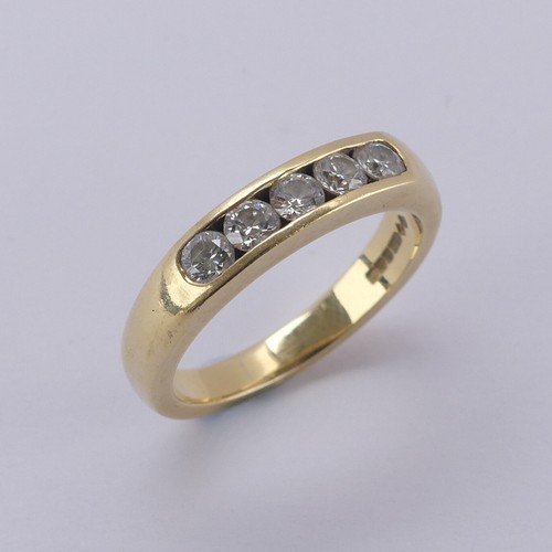 171 - A five stone diamond Ring, the brilliant cut stones each approx. 0.1ct, channel set in 18ct yellow g... 