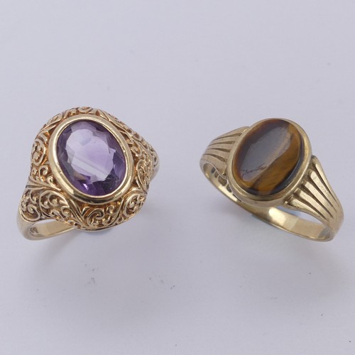 172 - An amethyst Ring, the oval facetted stone in a scrolling 9ct yellow gold mount, Size M, together wit... 