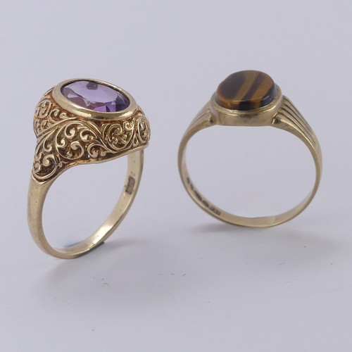 172 - An amethyst Ring, the oval facetted stone in a scrolling 9ct yellow gold mount, Size M, together wit... 