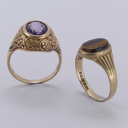 172 - An amethyst Ring, the oval facetted stone in a scrolling 9ct yellow gold mount, Size M, together wit... 