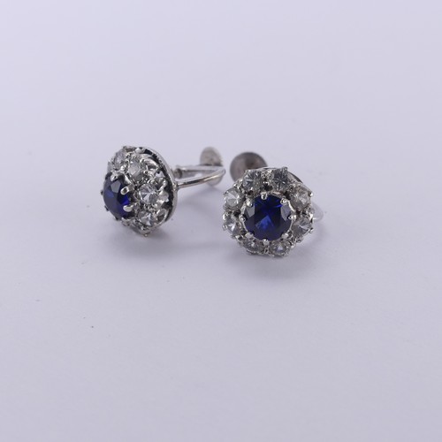 234 - A pair of synthetic sapphire cluster Earrings, the circular facetted stones claw set above a surroun... 