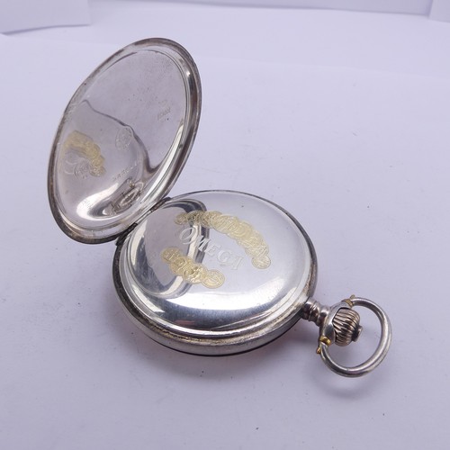 110 - An Omega silver hunter cased Pocket Watch, the signed white enamel dial with Arabic Numerals, subsid... 