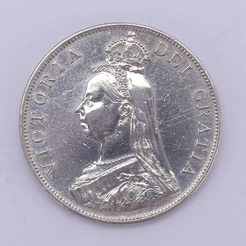 324 - A Victorian Crown, dated 1898, better grade, together with two others, 1894 and 1895, and a double f... 