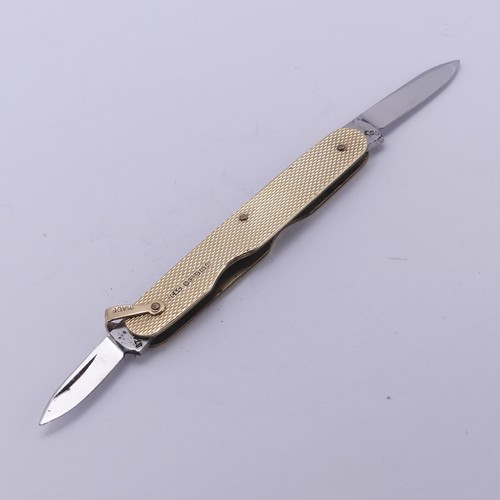 282 - A 9ct yellow gold Penknife, with engine turned decoration and two folding steel blades, vacant carto... 