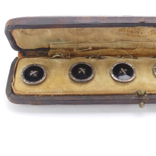 283 - An antique cased set of six black onyx Buttons, mounted in silver with gilt reverses, in a fitted 'L... 