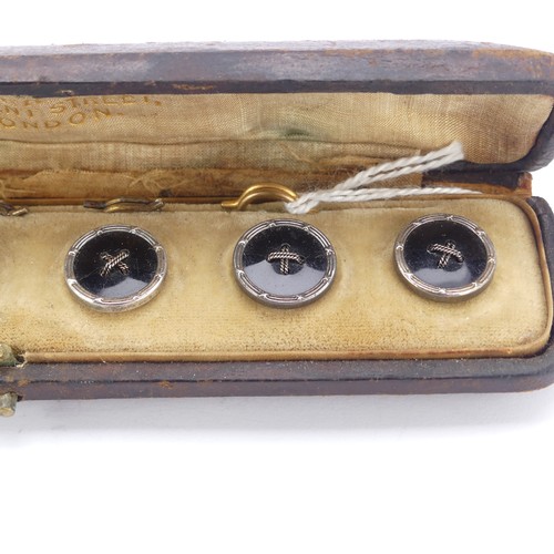 283 - An antique cased set of six black onyx Buttons, mounted in silver with gilt reverses, in a fitted 'L... 