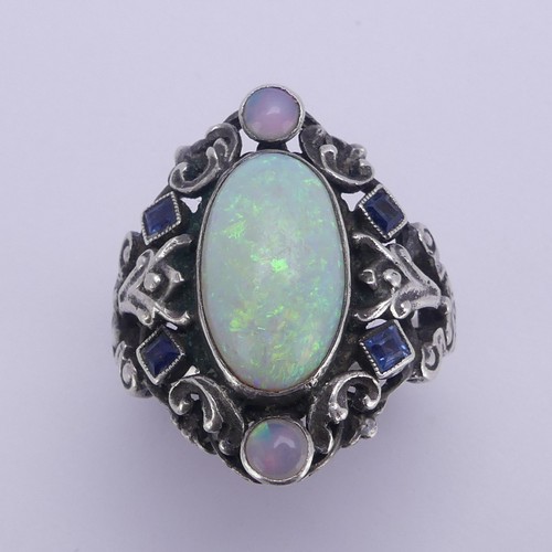 138 - An Arts and Crafts silver Ring, in the manner of Bernard Instone, with central cabochon opal, approx... 