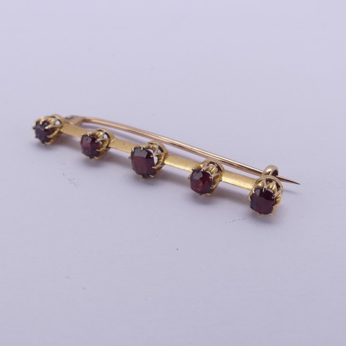 226 - A graduated five stone garnet Bar Brooch, the circular facetted stones claw set, all unmarked, the b... 