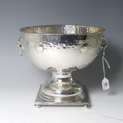 55 - A silver plated Punch Bowl, with hammered decoration and lion mask ring handles, raised on square ba... 