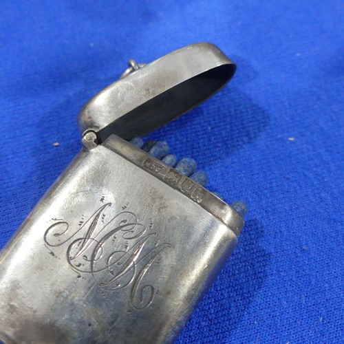 66 - An Edwardian silver Vesta Case, hallmarked London 1903, initialled, together with a silver backed ha... 