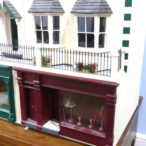 327 - A very large 20th century scratch built hand painted Dolls House, consisting of four floors, ground ... 