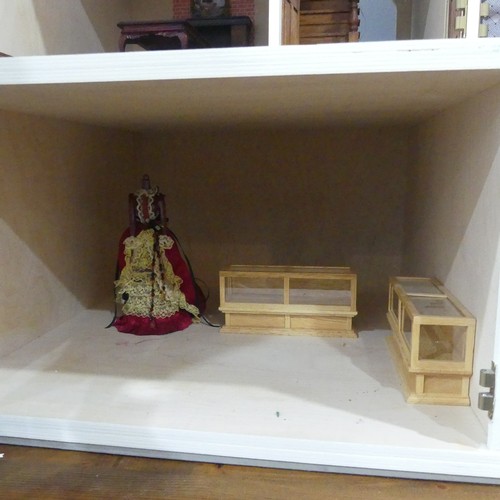 327 - A very large 20th century scratch built hand painted Dolls House, consisting of four floors, ground ... 