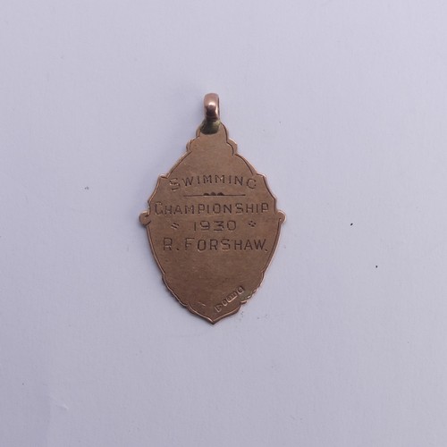 250A - A 9ct rose gold and enamel Fob, hallmarked Chester 1929, with swimming prize inscription, 6g, togeth... 