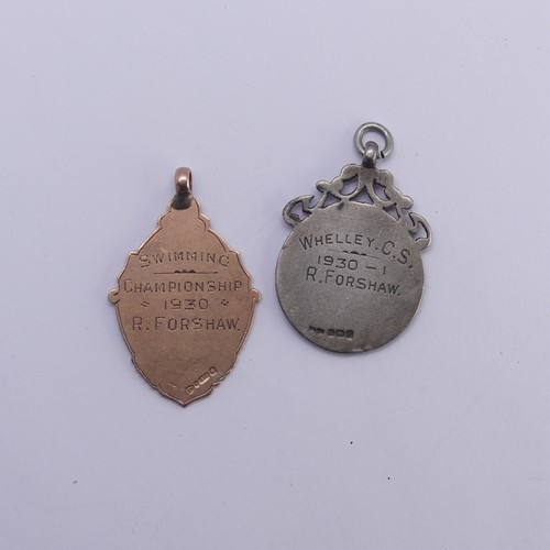 250A - A 9ct rose gold and enamel Fob, hallmarked Chester 1929, with swimming prize inscription, 6g, togeth... 