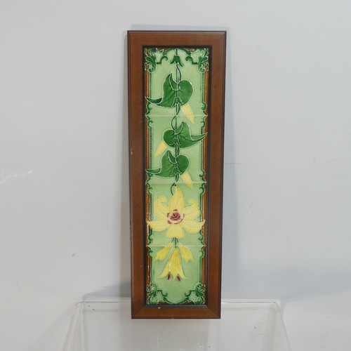 531 - A Maw & Co framed set of three Tiles, painted with flower stems in ruby lustre on a cream g... 