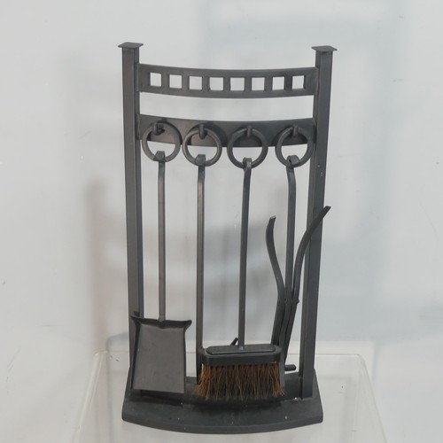 543 - A set of four wrought iron Fire Irons, together with another set of fire irons, a large brass trivet... 