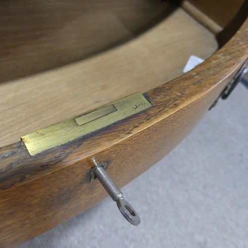 500 - Attributed to Shapland and Petter of Barnstaple, an Arts and Crafts oak Desk, the three quarter gall... 