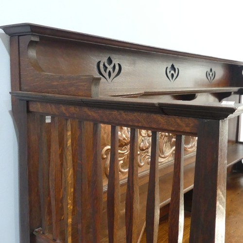 513 - A Shapland and Petter of Barnstaple Arts and Crafts oak Sideboard, the raised top with pierced flora... 