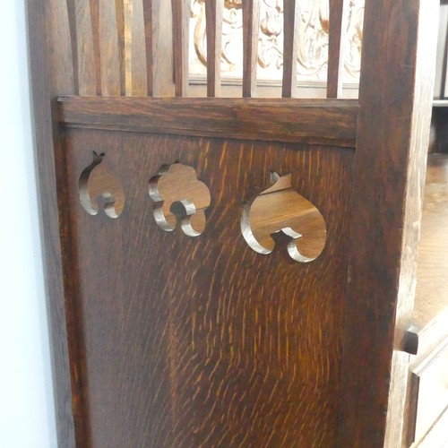 513 - A Shapland and Petter of Barnstaple Arts and Crafts oak Sideboard, the raised top with pierced flora... 