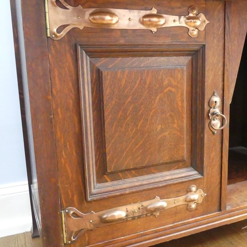 513 - A Shapland and Petter of Barnstaple Arts and Crafts oak Sideboard, the raised top with pierced flora... 