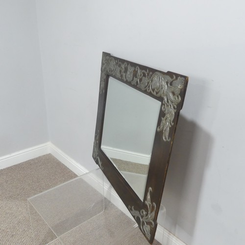 518 - An Arts and Crafts oak and pewter Mirror, of a rectangular form, the beveled mirror encased in frame... 