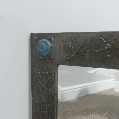 521 - An Arts and Crafts pewter Mirror, the frame embossed with stylised flowers and birds, inscribed 'Van... 