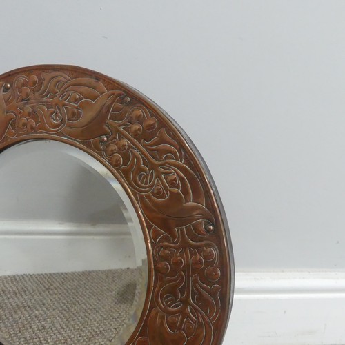 535 - An Arts and Crafts copper circular Mirror, in the manner of the Keswick School of Industrial Ar... 