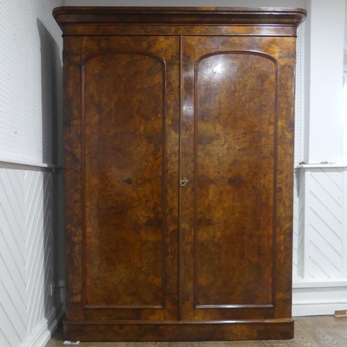 561 - A Victorian burr walnut compactum Wardrobe, the moulded cornice over two doors concealing interior w... 