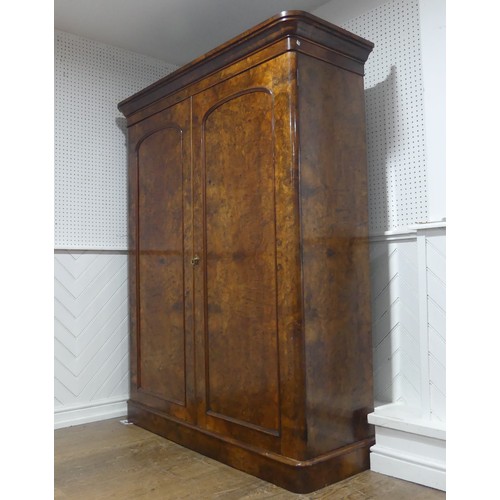 561 - A Victorian burr walnut compactum Wardrobe, the moulded cornice over two doors concealing interior w... 