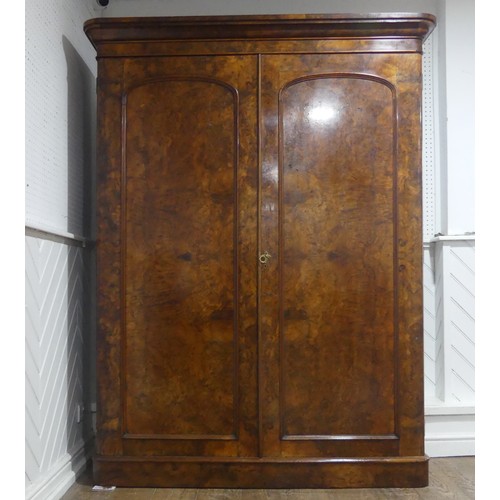 561 - A Victorian burr walnut compactum Wardrobe, the moulded cornice over two doors concealing interior w... 