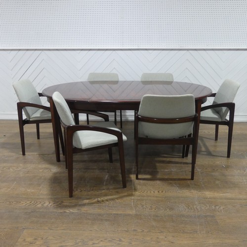 557 - A set of six Danish ''Paper Knife'' rosewood dining Armchairs and Table, 1960s, the design attribute... 