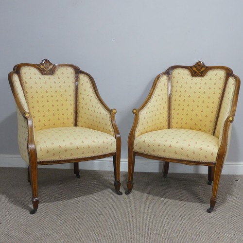 612 - A pair of Edwardian upholstered show-frame Armchairs, with scrolled arms, raised on tapering support... 