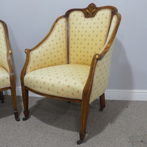 612 - A pair of Edwardian upholstered show-frame Armchairs, with scrolled arms, raised on tapering support... 