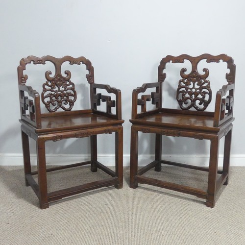 568 - A pair of late 19th/early 20th century Chinese carved hardwood Armchairs, with scrolled top rails ab... 