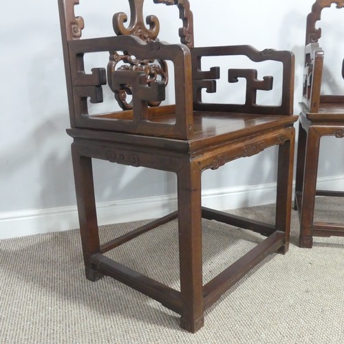 568 - A pair of late 19th/early 20th century Chinese carved hardwood Armchairs, with scrolled top rails ab... 