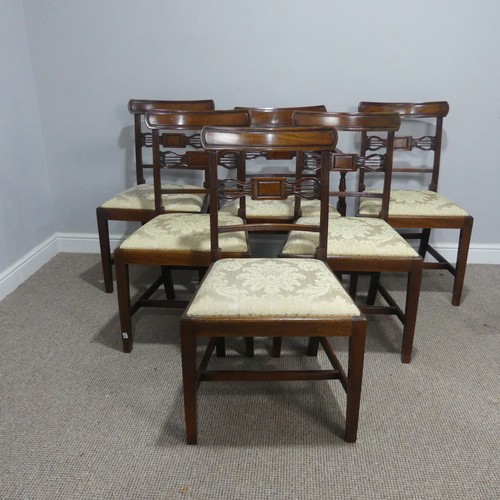 611 - A set of six Georgian mahogany dining Chairs, with one carver, each with a carved centre-rail and up... 