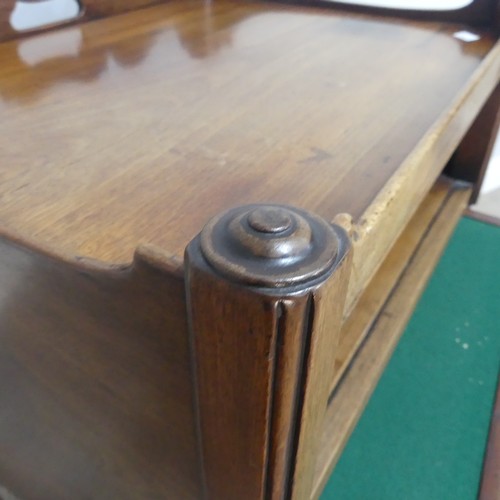 676 - A 19th century mahogany tray-top Commode, the shaped gallery pierced with handgrip, above open shelf... 