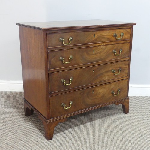 579 - A Georgian mahogany Chest of drawers, of small proportion, the reeded top over four graduating drawe... 