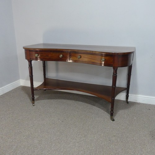 580 - An early 19th century mahogany kidney-shaped dressing/side Table, inlaid with ebony stringing, the k... 